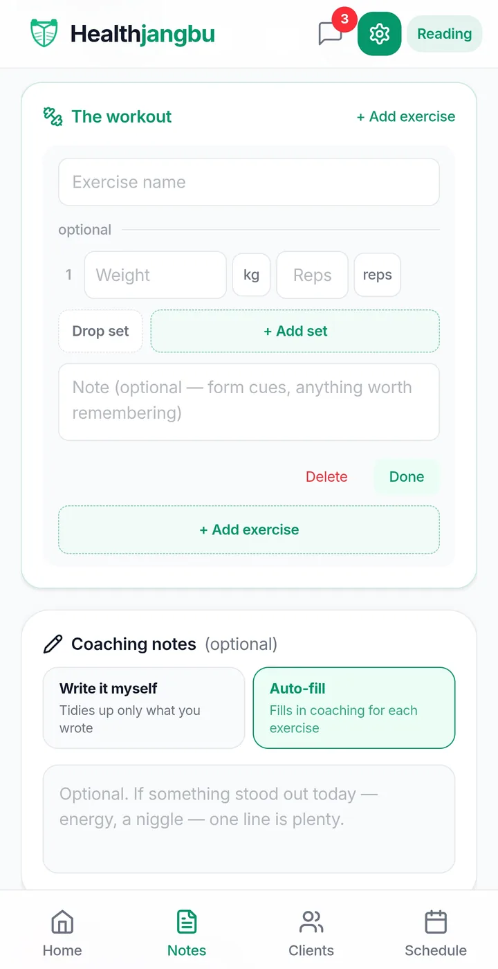 A trainer entering the session's lifts and coaching notes